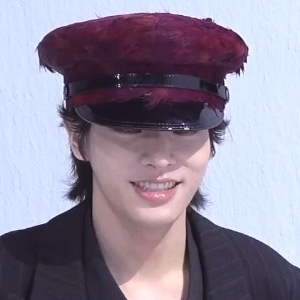 curled up black hair in this hat