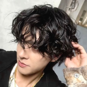 dark brown curly hair with bangs