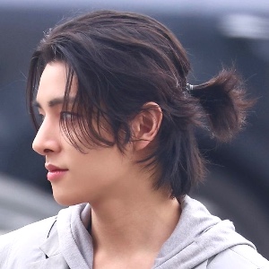 long dark brown hair with a bun