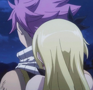 Lucy hugging Natsu after their win