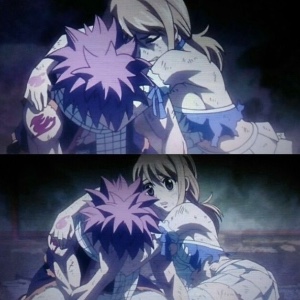Lucy’s holding onto Natsu