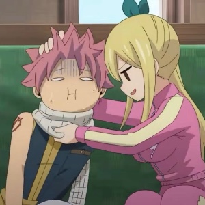 Natsu beating the guys who flirted with Lucy