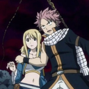 Natsu protecting Lucy against Michelle