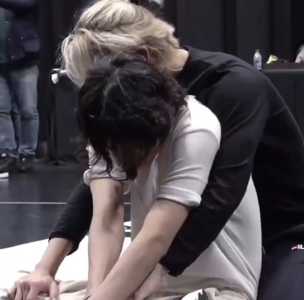 backup dancer saying “the blonde one and the curly haired guy were all over each other”