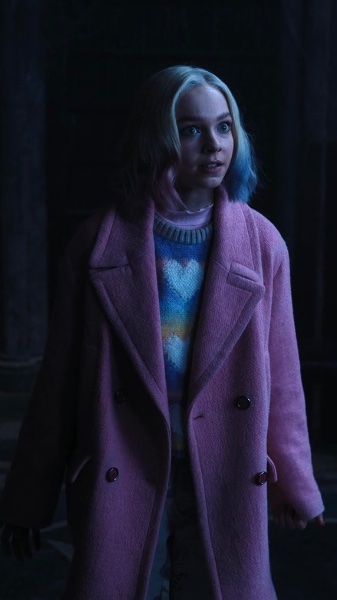 enid s1 chill in dorm w/ coat