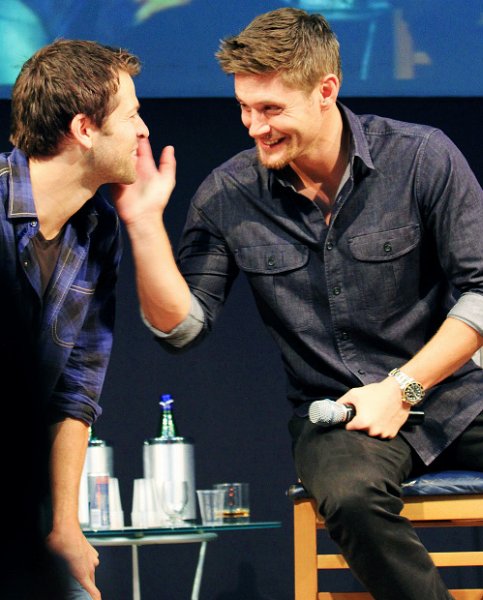 Jensen playfully pushing Misha's head away