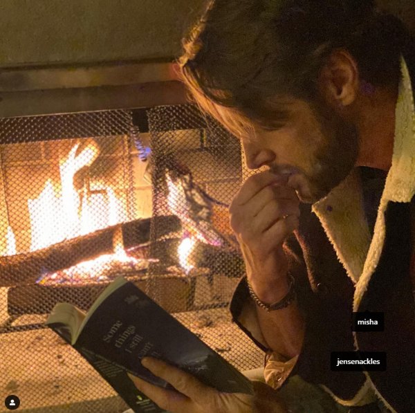 Jensen reading Misha's book, Misha tagged over his heart