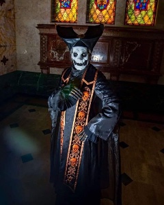 Black and gold robes with cornette